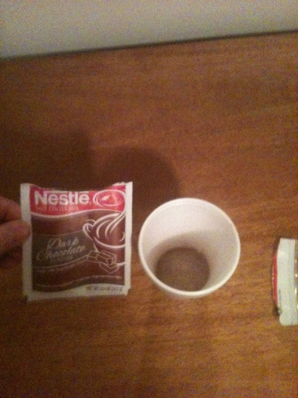 After you have all of the necessary supplies, fill the mug or cup with the correct amount of hot chocolate mix.