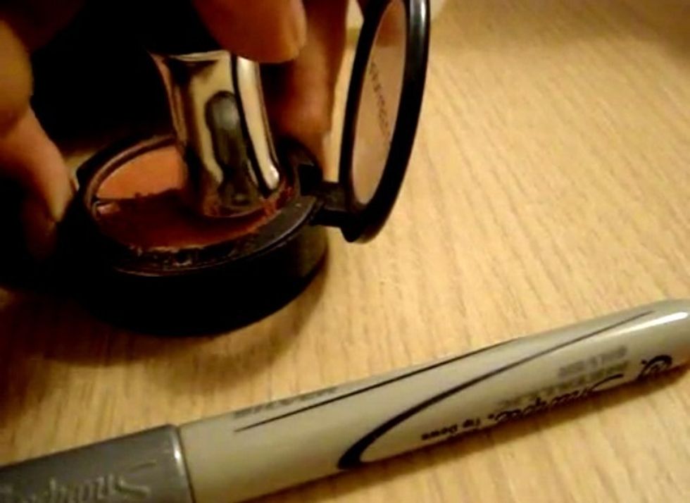 After you have finish crushing the make-up now flat the make-up....here I'm using the top of the nail polish you my use anything you like, but I saw this as my easy way to flat it lol :)