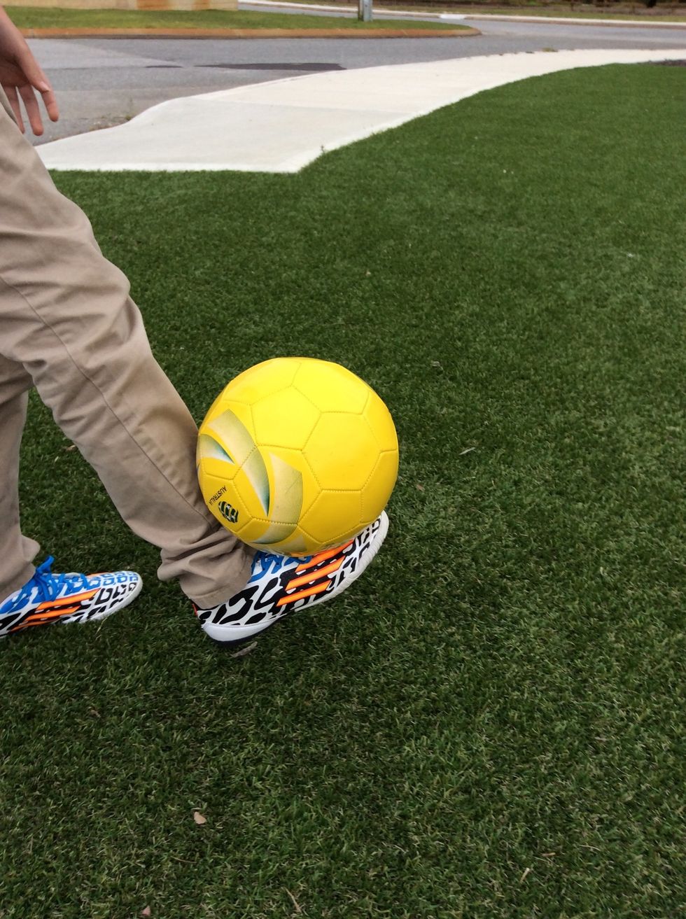 After you have had a feel of the soccer ball you will need to try and balance the ball on top of your foot, make sure your back is straight for extra balance.