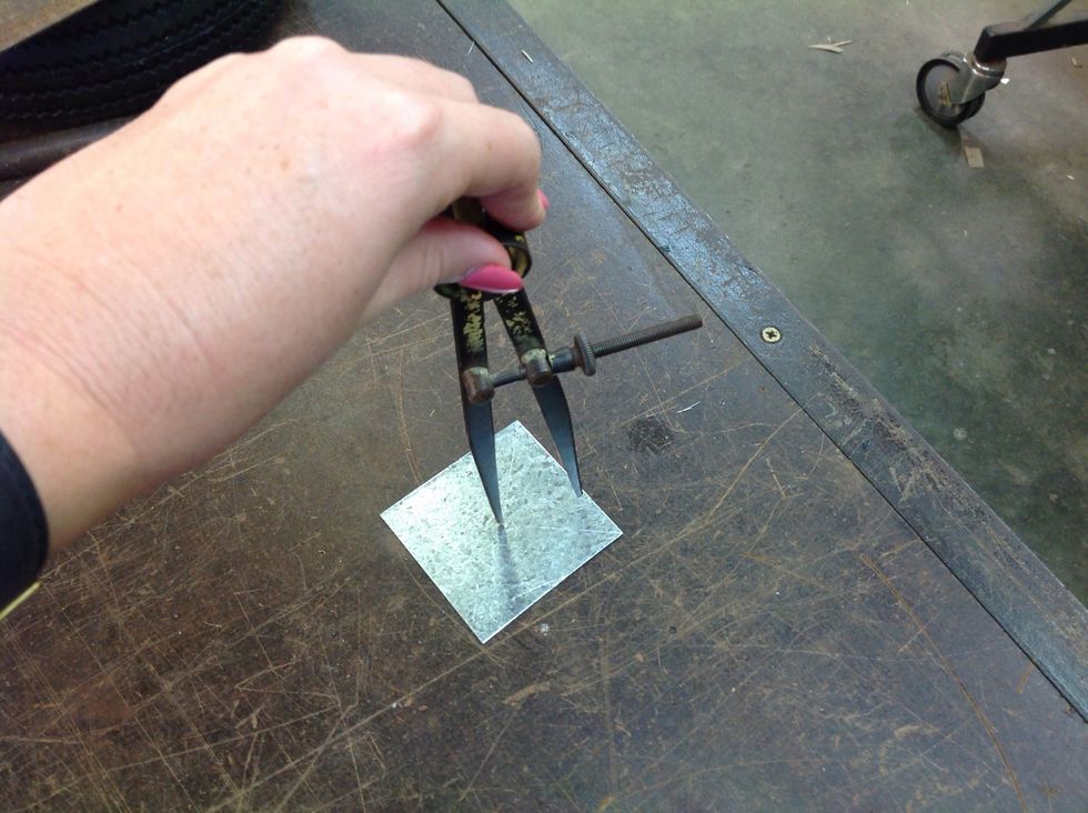 After you have made your hole, you use a compass to mark a circle. Make sure you go through the circle a few times so it is easier to tell when cutting.