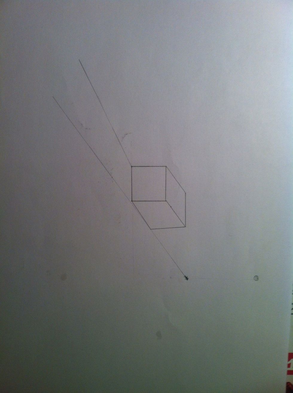 After you have marked your floor.Draw two straight lines through each of the visible bottom corners of block.