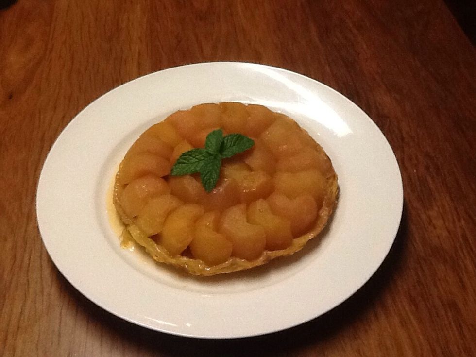 After you have partially cooled the tarte tartin, flip it out onto a nice plate and leave it to cool some more (optional). When it is cooled enough, serve it with cream, ice cream or custard.