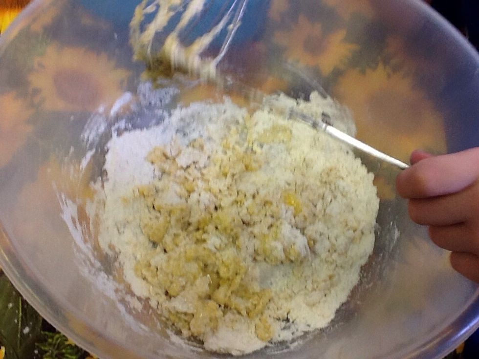 After you have put the eggs into the bowl and have cracked them you have to whisk up the eggs and plain flour in a cooking bowl.