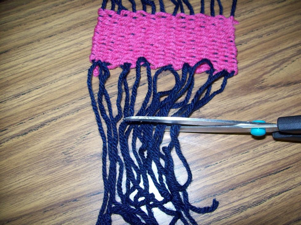 After you have tied all of the warp string pairs across the weave, you may trim them to your desired length.