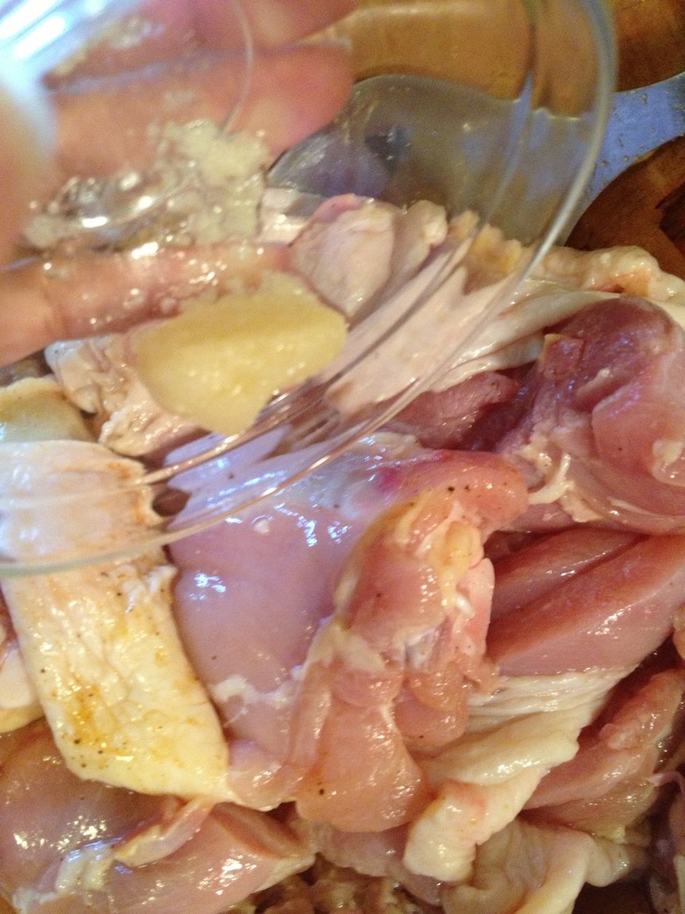 After you have washed your chicken, add the garlic paste