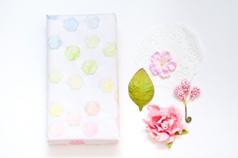 After you have wrapped the gift, use embellishments like Prima doilies & flowers to enhance the wrapping.