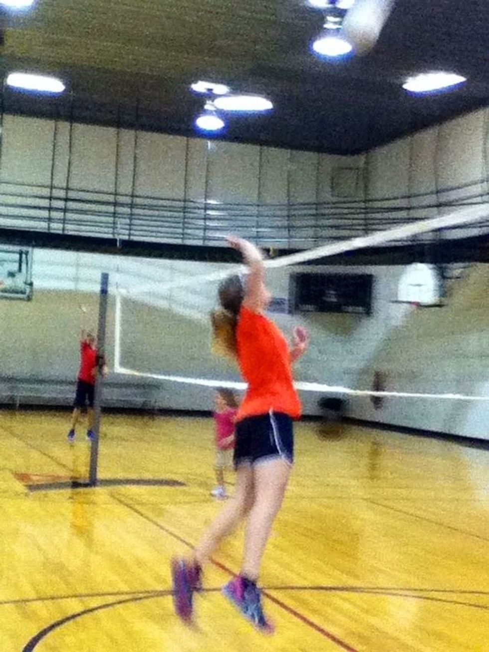 After you jump bring your arms above your head ready to hit.