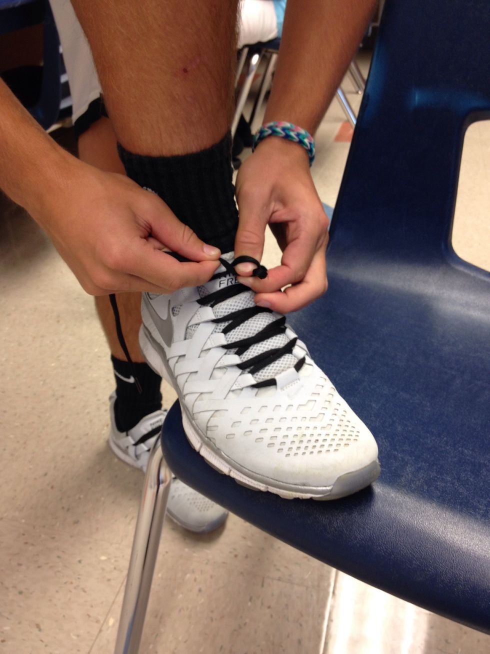 After you make a bunny ear, wrap a loop around it.