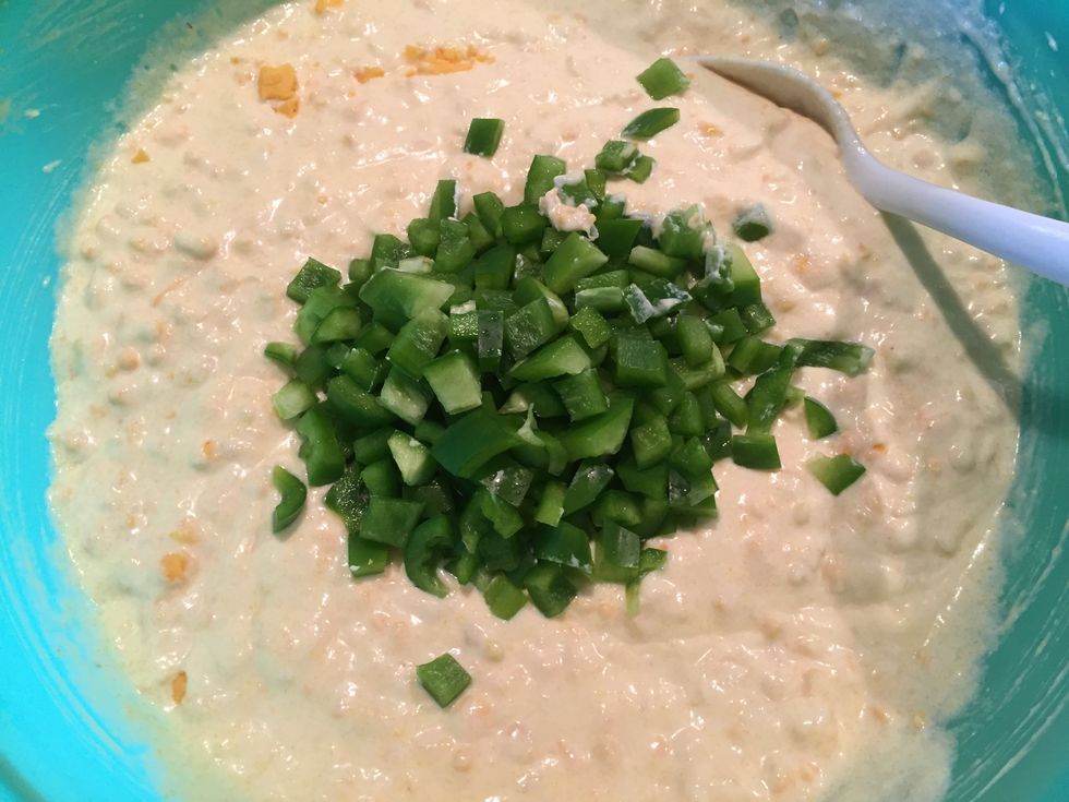 After you mixed in the cheese, add in the bell peppers. If you don't like the green ones, use the red ones. They give the dish some bright spots of color too!
