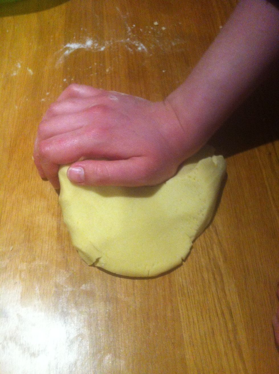 After you mixed the ingredience you knead it all together to a smooth dough