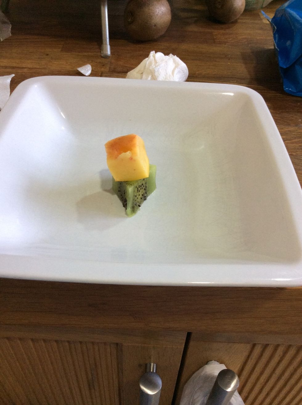 After, you need to put your kiwi on the bottom and peach on the top