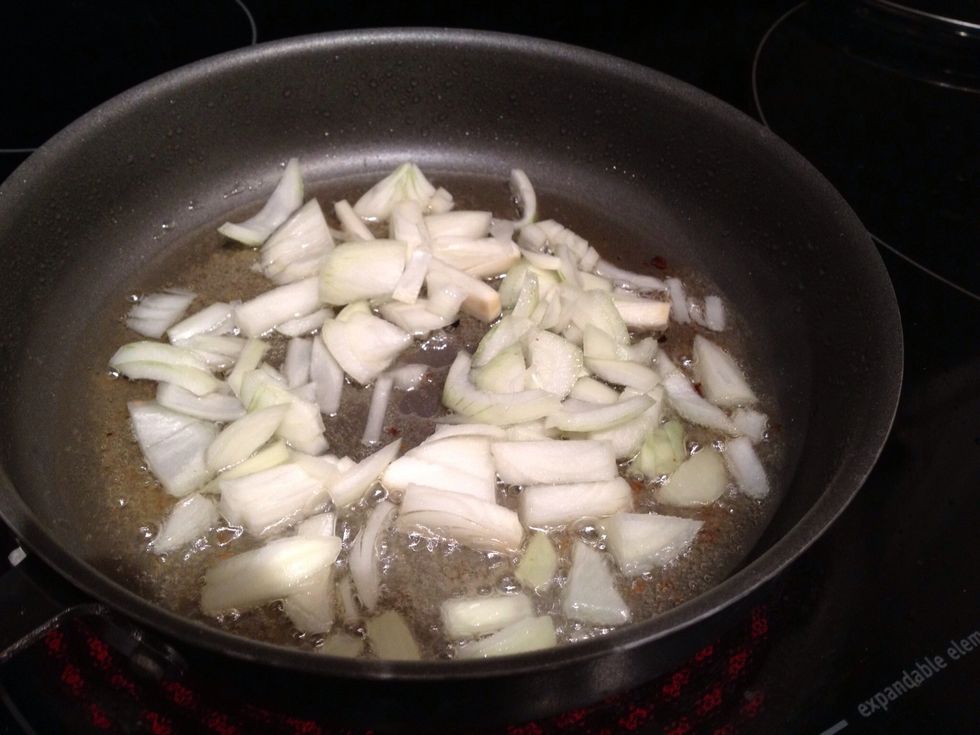 After you put the fish in the oven, throw the chopped onion into the same pan you browned the fish in. Add more oil if need be.