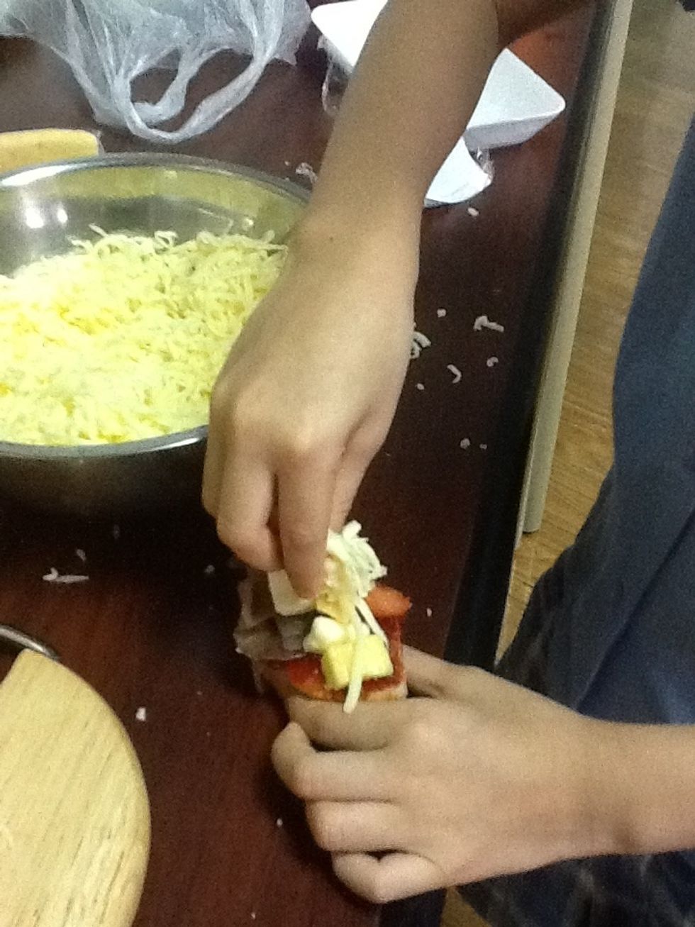 After you put the toppings on you put the cheese on top.