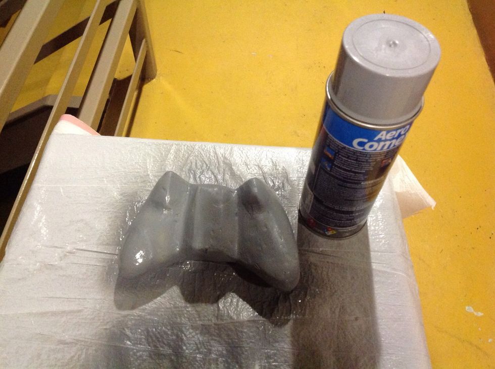 After you're done sanding it's time to begin the painting process. First you need to apply two layers of the spray paint primer. Primers usually come in weird colors, don't worry about it.