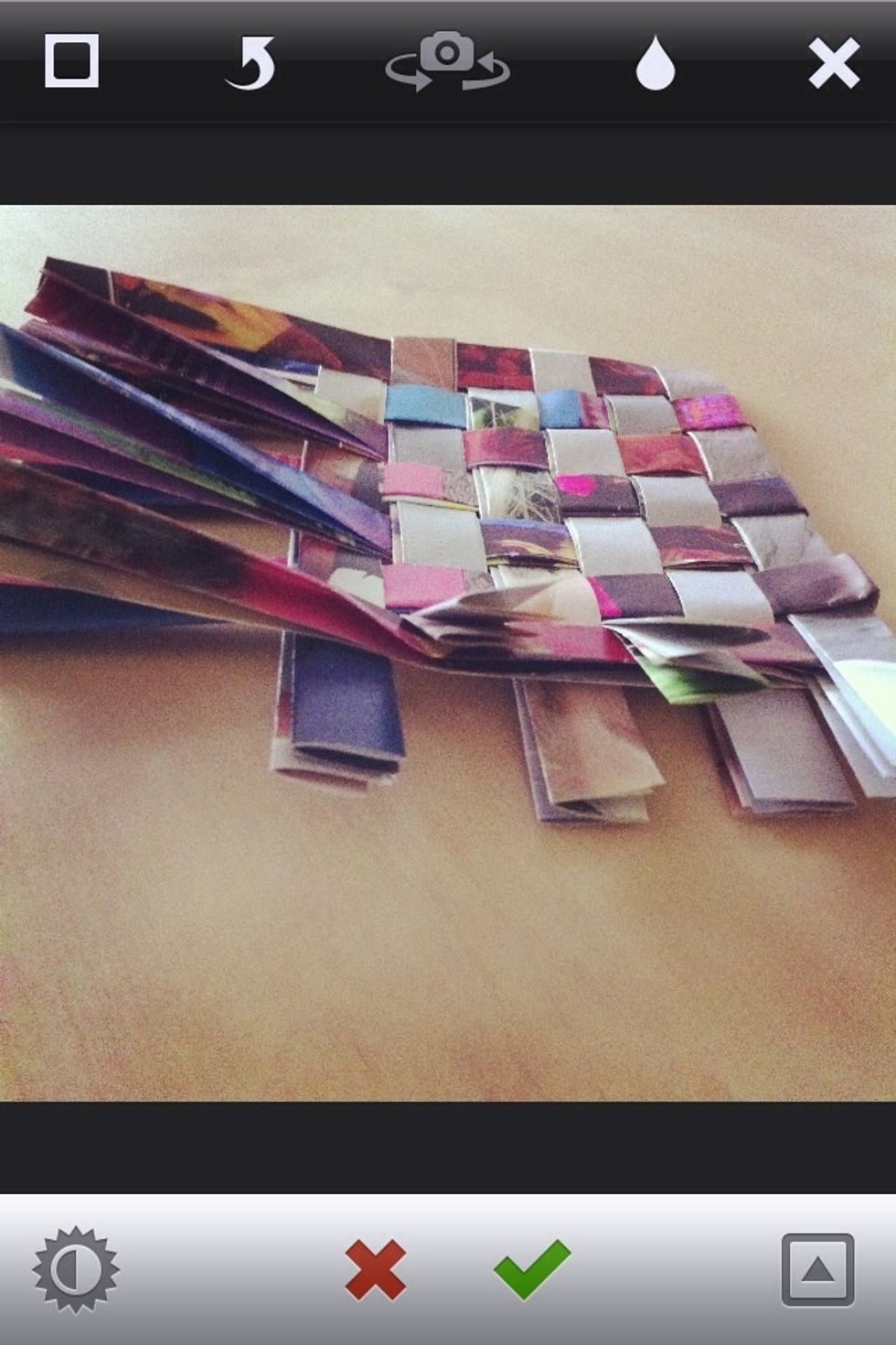 After you're done weaving the paper strips you can cut the ends if the strips and glue them underneath the folds.