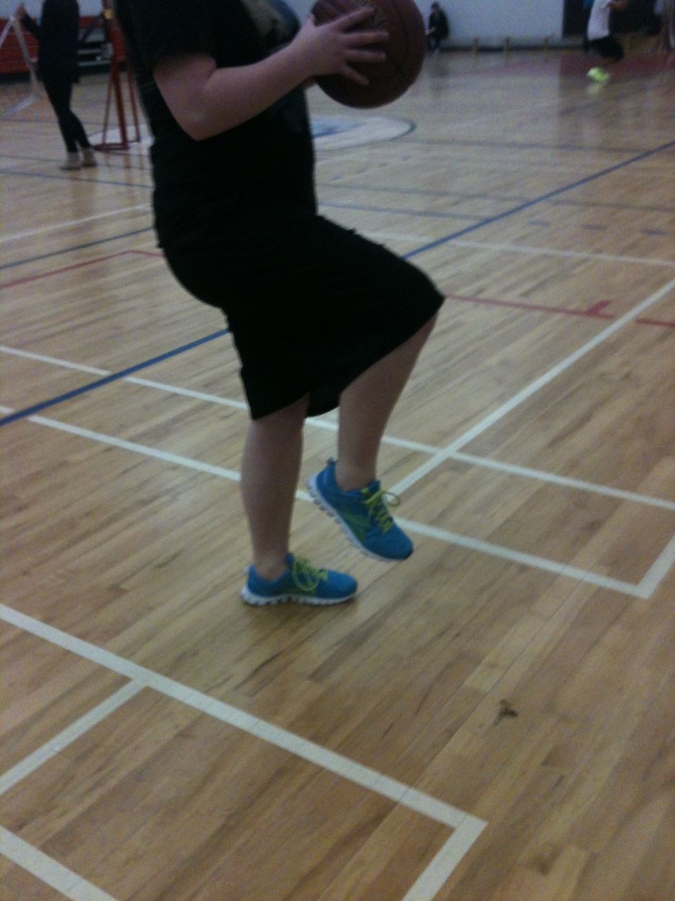 After you take your second step with your left foot, you want to bring up your right foot. This will help you extend and get a better reach to the hoop allowing you to get the ball in.