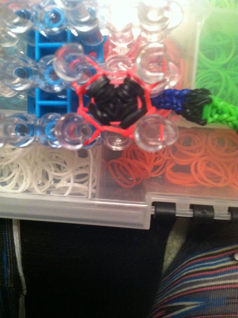 After you've done all your colors, take your 3 left over red bands and loop them like you did with all the others