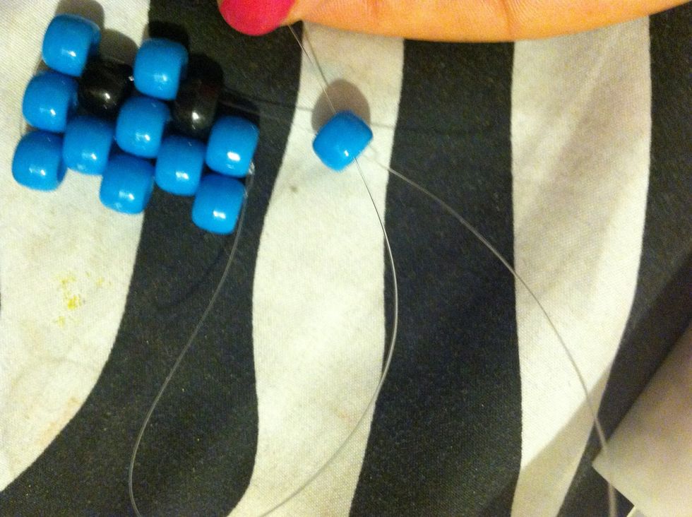 After You've Done That , Your Going To Add Another Blue Bead And Them One More , But When You Go To Add Your Last Bead You'll Notice There's No Bead The String Through so you'll take you other \ud83d\udc49
