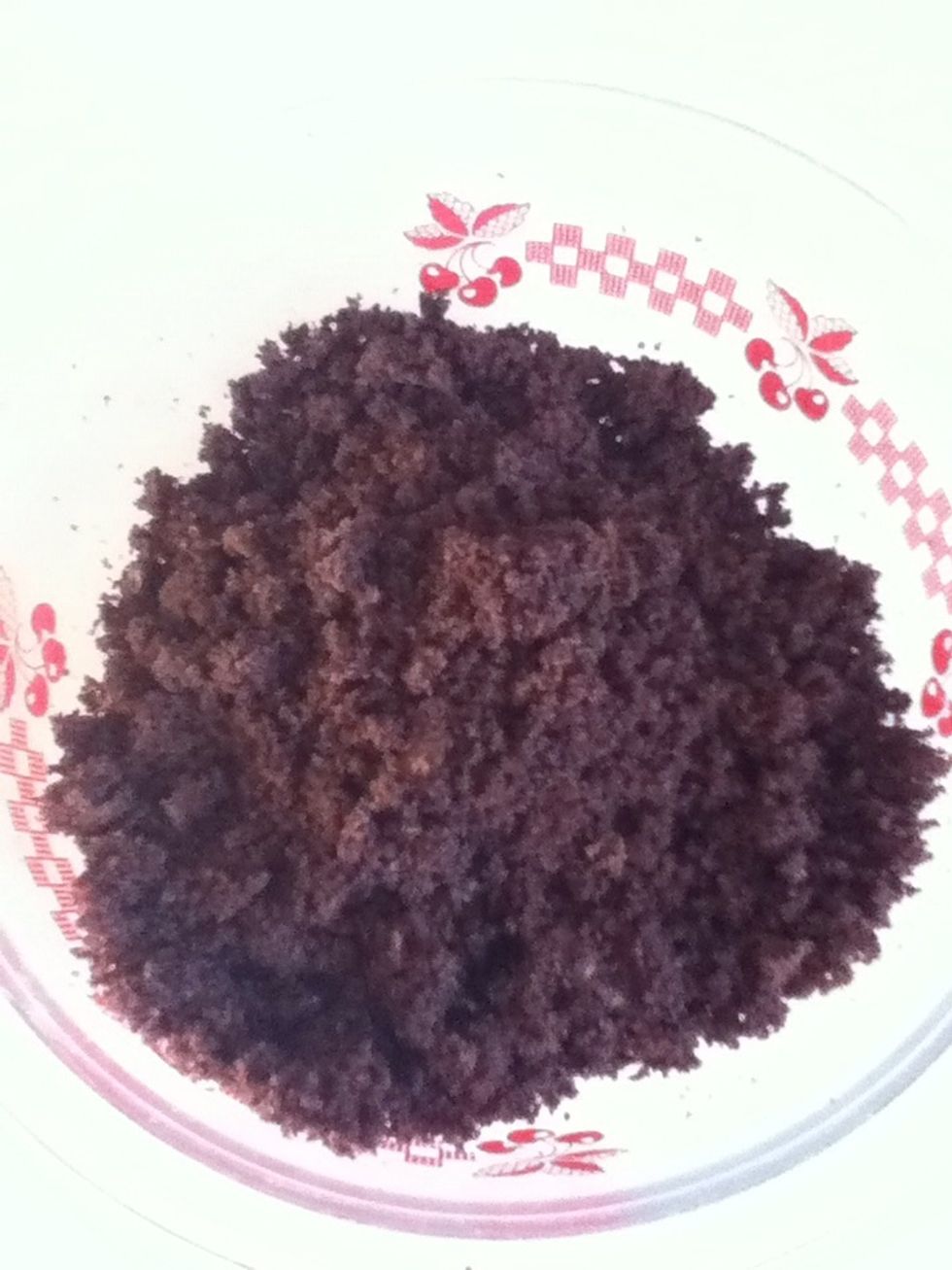 after you've made your cake and its cooled, put it in a bowl and crush it all up, ( I used my hands) so that it looks like this.