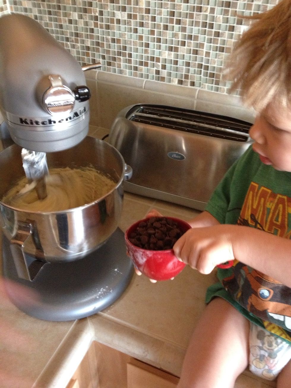 After you've made your dough, have your chocolate assistant step in and add the goods. (Turn mixer off to make it easy and safe for assistant.)