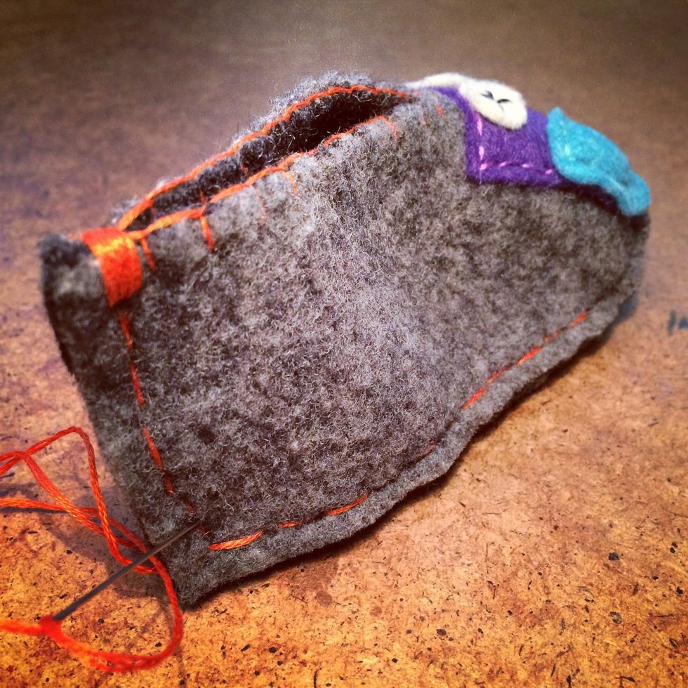 After you've stitched the top and bottom together then tie up the end.