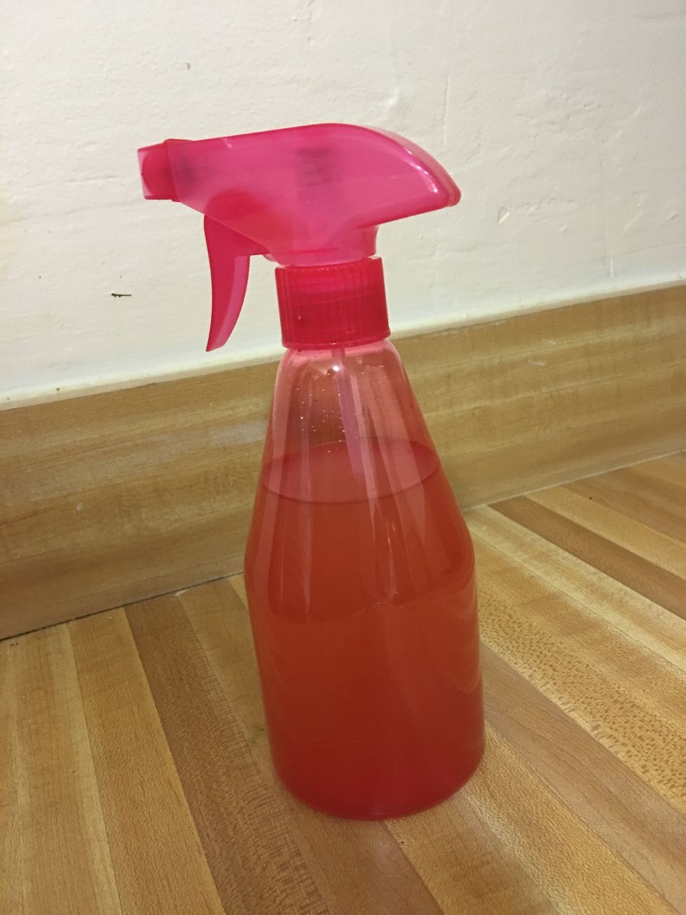 After you wash your hair, spray the vinegar mix into your hair. Massage your hair and scalp gently. Leave on for 2-3 minutes. Rinse thoroughly. Style as usual.