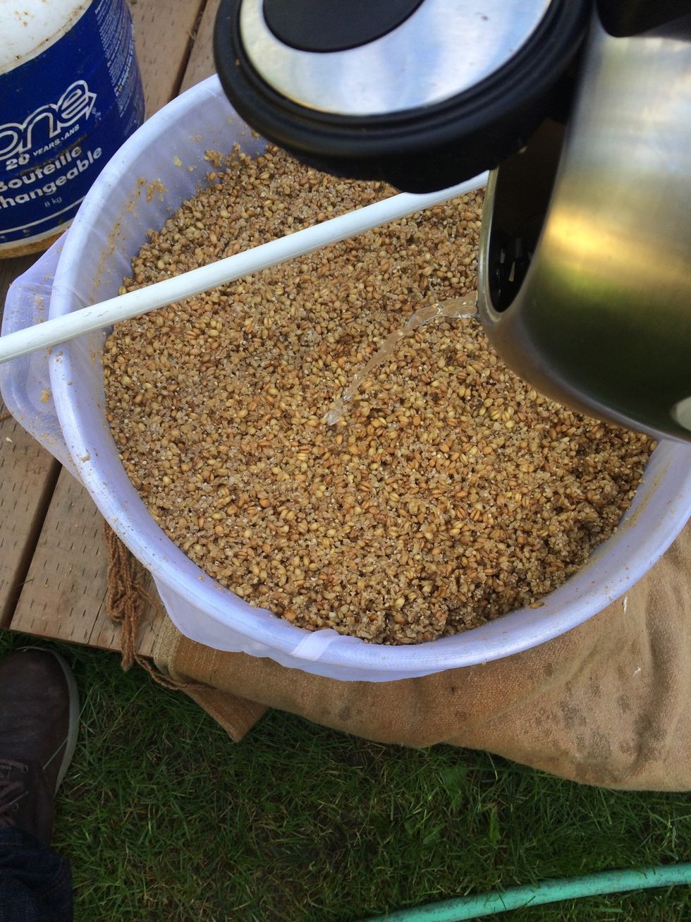 After your 60 minute mash. Slowly pour in all of your 200F sparge water over and through your grains.