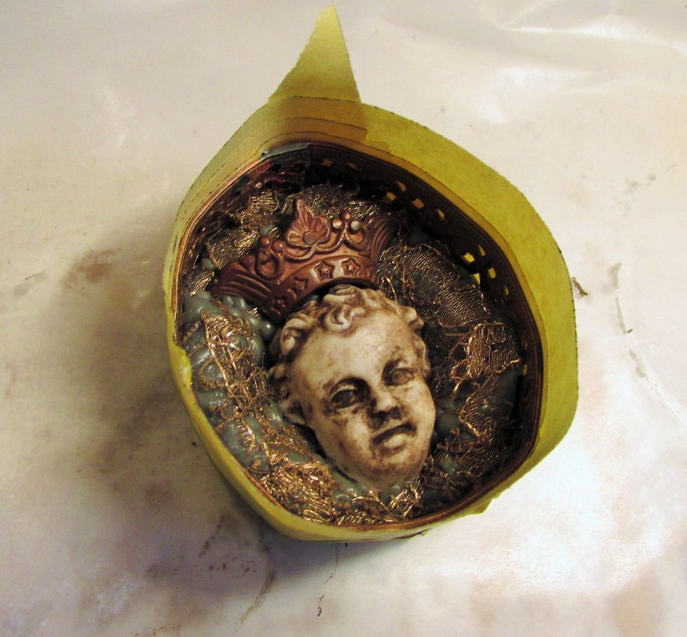 After your apoxy has dried, apply painters tape all the way around your piece. make sure it is sealed well enough so when you pour your resin it will not seep out. Let dry 24 hours