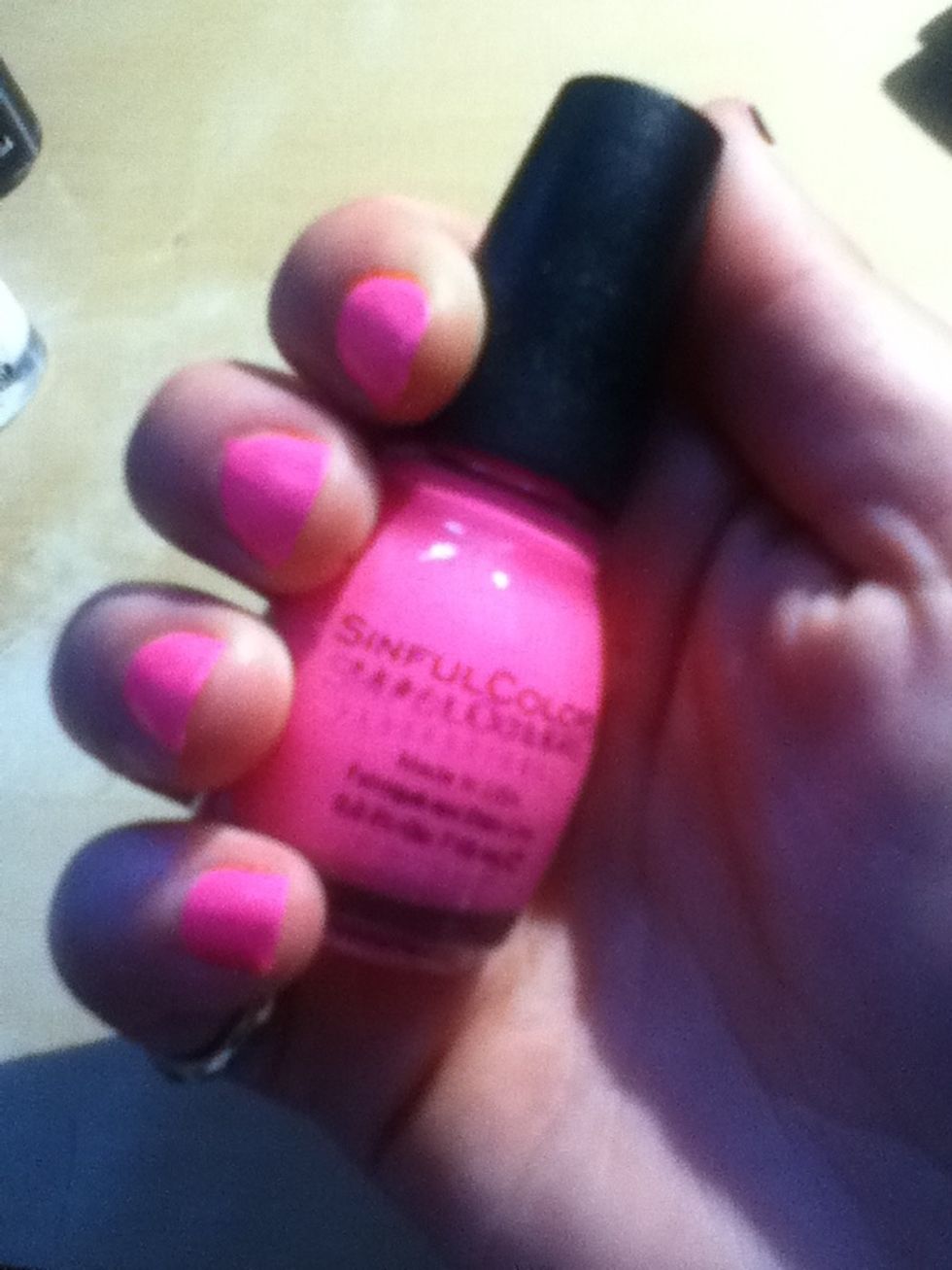 After your base coat dries you can do one or two coats of your first layer I chose 24/7 by sinful colours professional it is a bright pink. (Sorry the quality isn't very good)