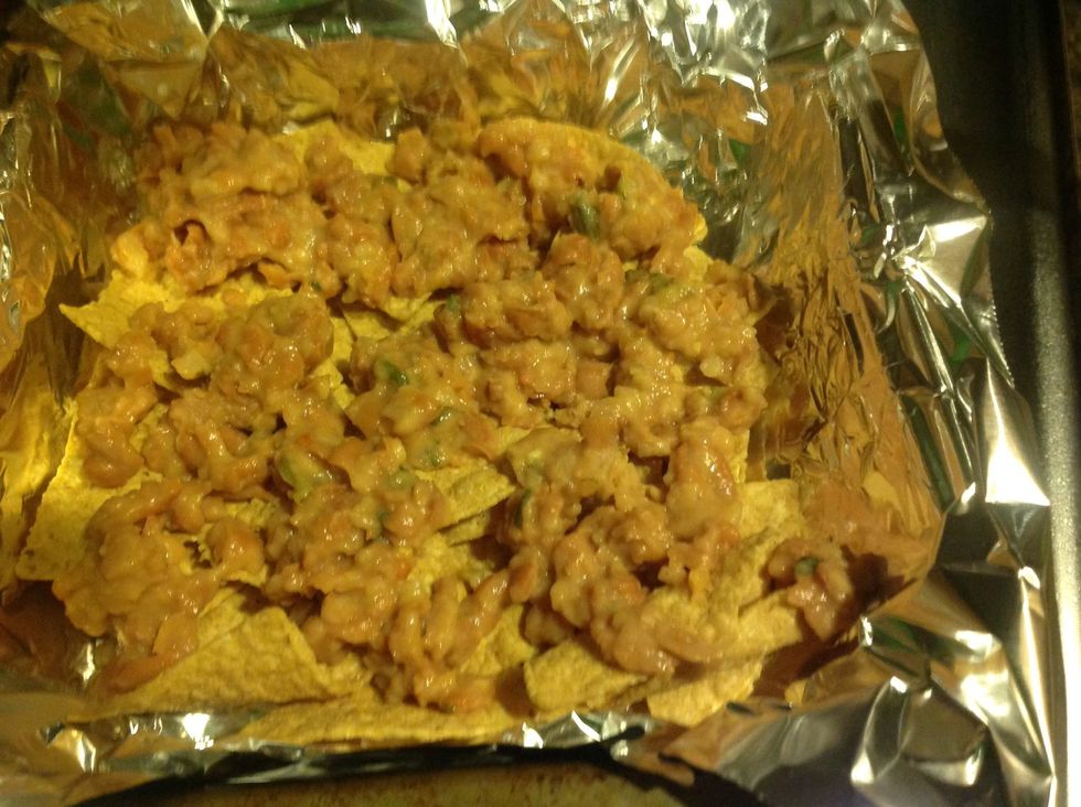 After your beans have cooled a little (ok to be hot, but better if not steaming), drop by spoonfuls onto the chip layer. It's ok if some parts are not covered.