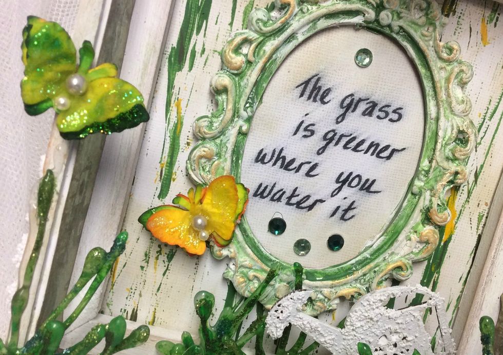 After your butterflys are dry, glue 3 together for layered effect. Using Glossy Accents, I applied the pearls. And for the "icing on the cake" I dabbed clear Stickles to the tops of all the wings.