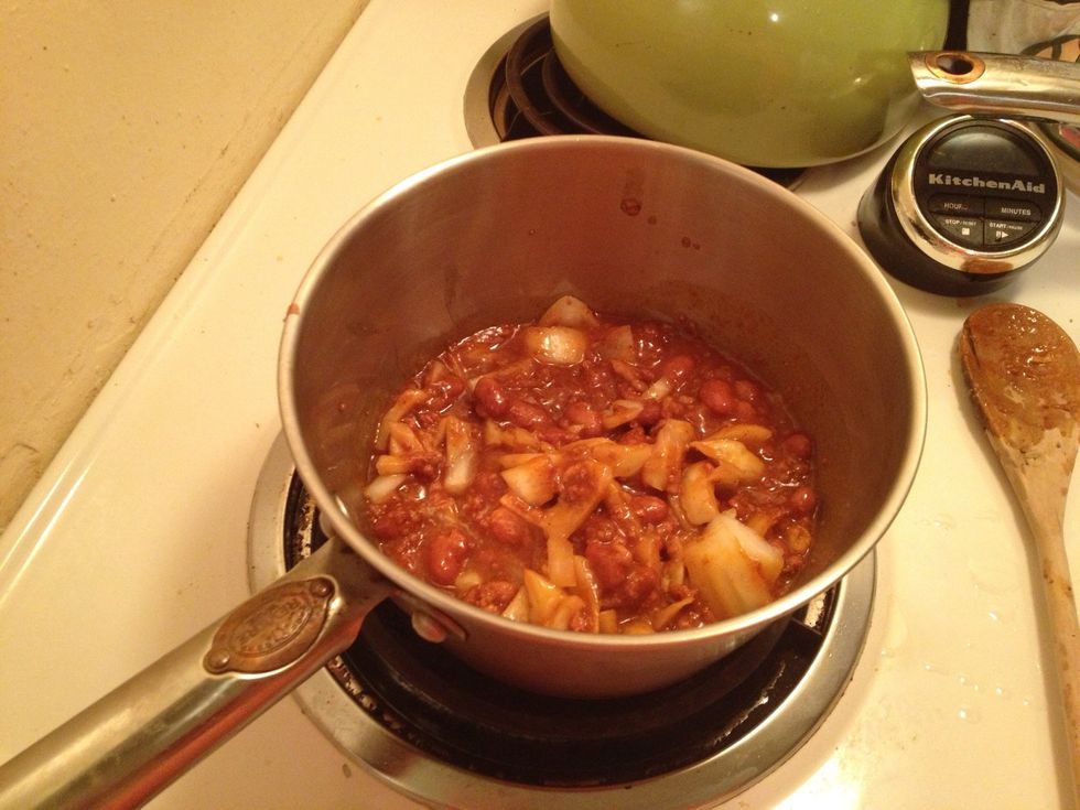 After your chips are done. Salt them and set aside. Put a can of chili in a pot or throw your own together. However you wish to do. I used a can of Nalley and added some onion. Have the burner on 5-6