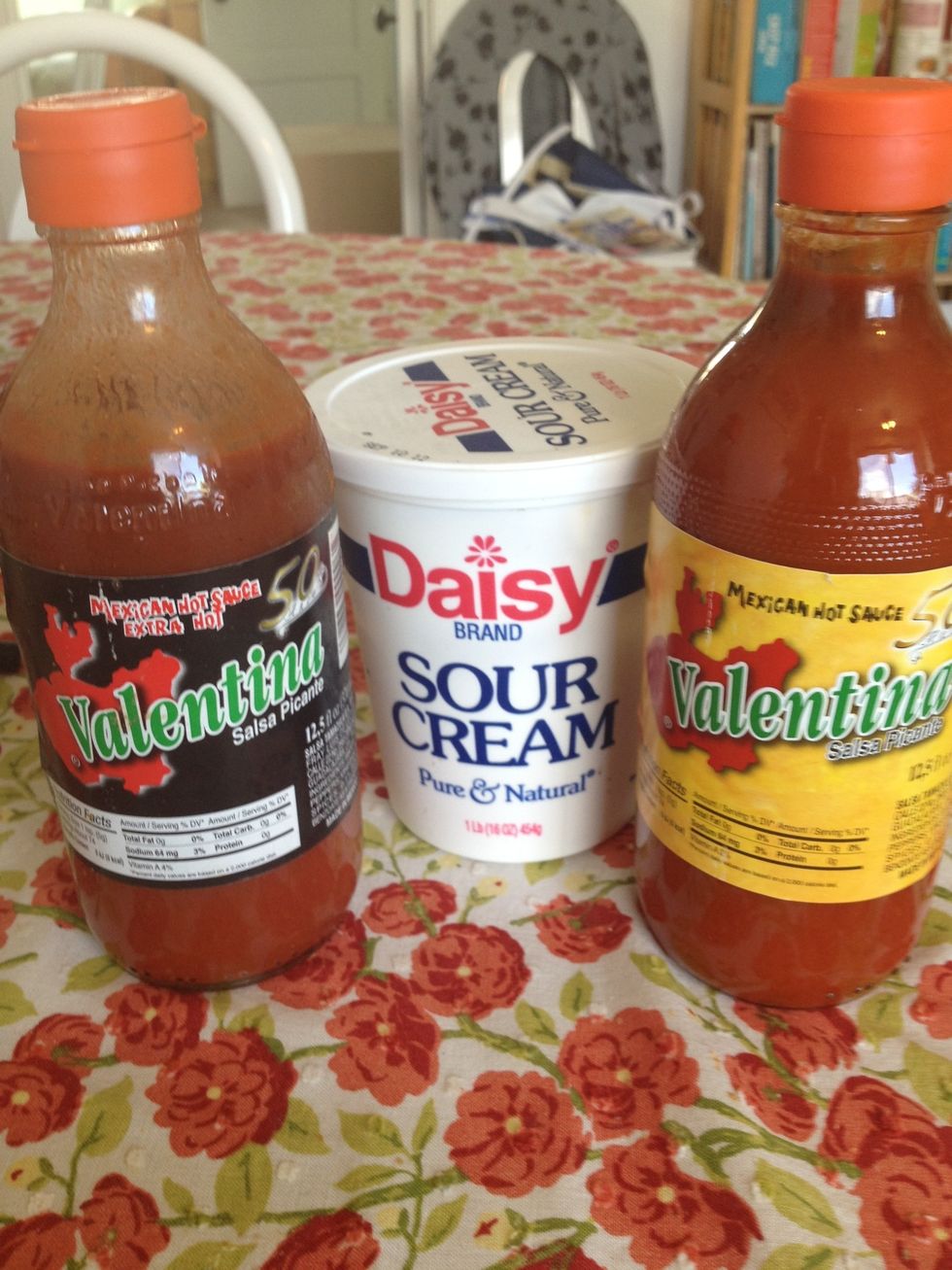 After your enchiladas come out of the oven serve with sour cream on top and your favorite hot sauce...or mine, Valentina.