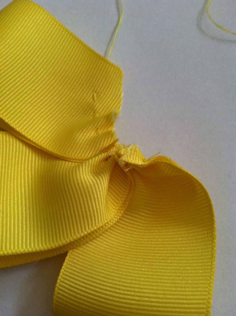 After your third piece you may find it easier to begin scrunching now, you can also wait till all your 'petals' are attached but it gets a little more difficult. Scrunch by gently tugging the thread.