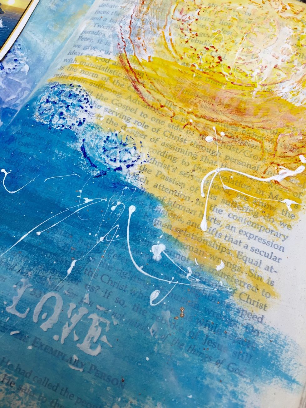 Afterward I used a stronger colored gelato to lightly apply over the relief work and pull it forward. The white splatters are white gesso done with a brush