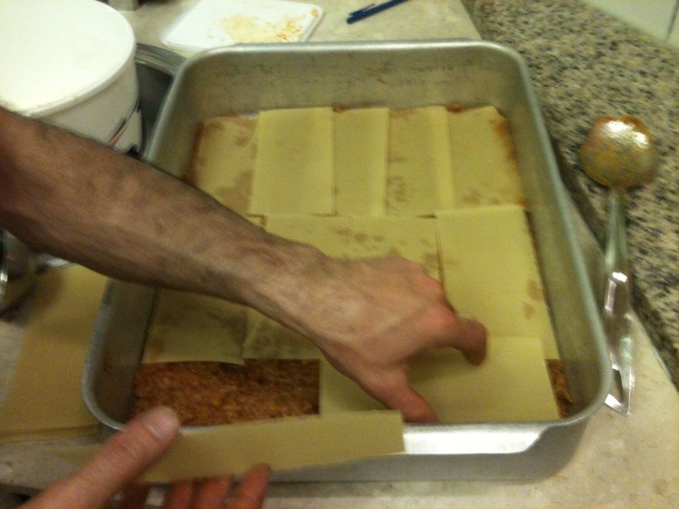 Again, cover with the pasta sheets.
