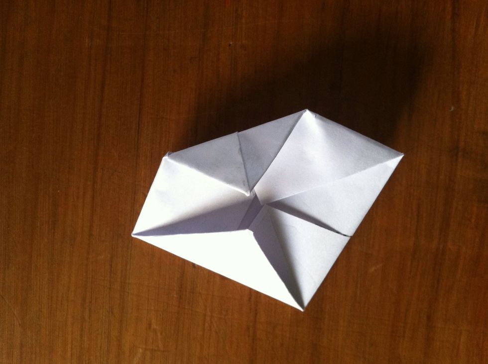 Again, fold all the corners to the center