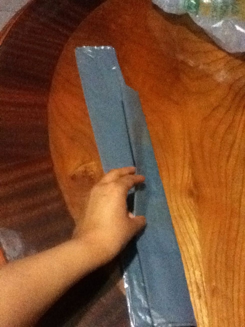 Again fold the bag in half to get it like a thick ribbon