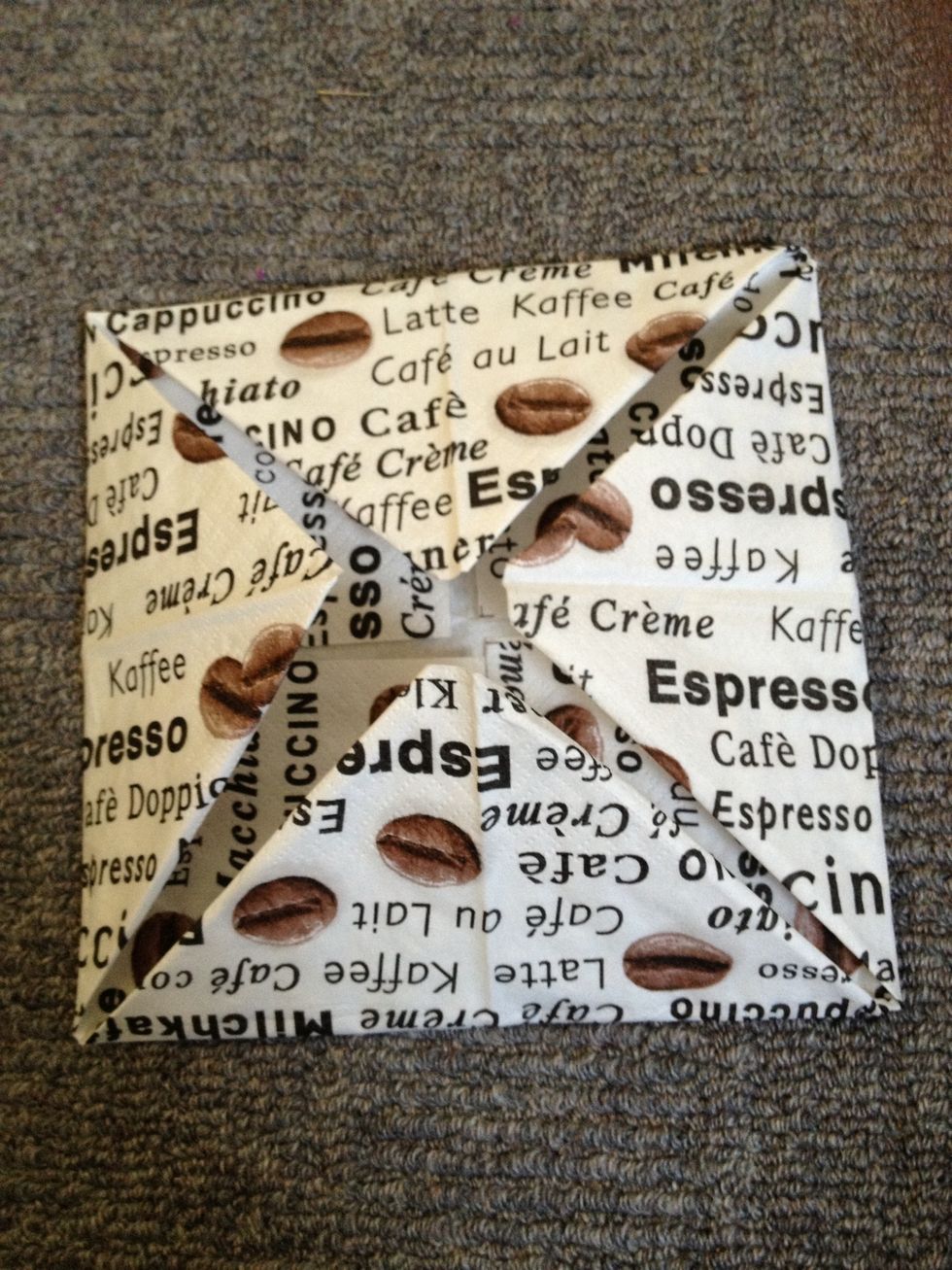 Again fold the corners to the middle.