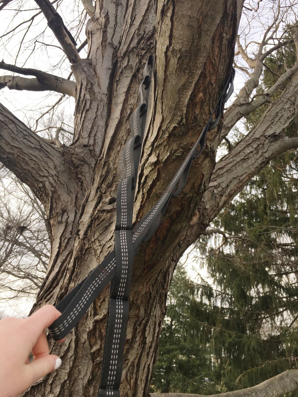 Again, pull one side of the strap through the loops of the other side.