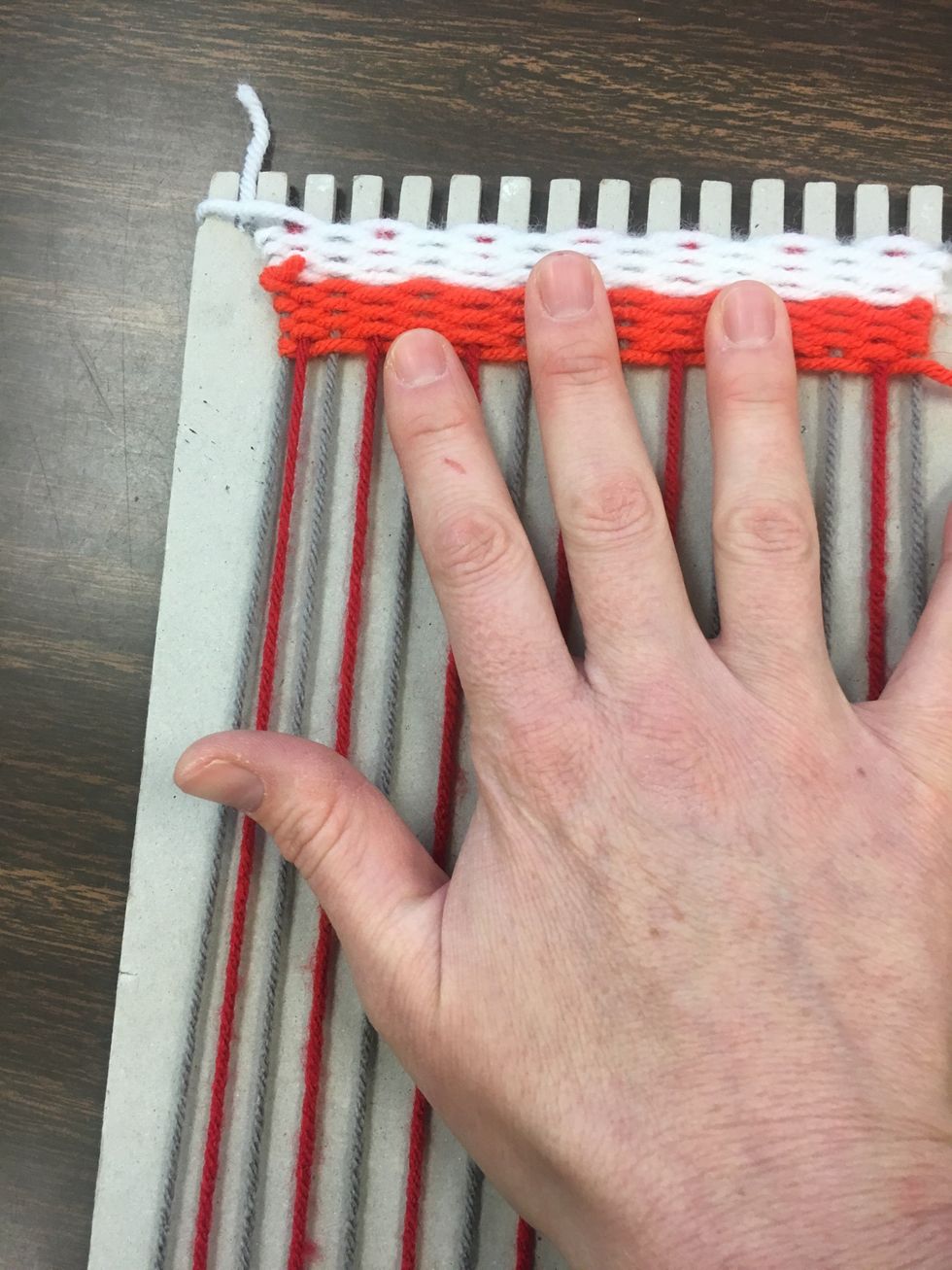 Again, pushing each color and line gently up so that the weave has no gaps.