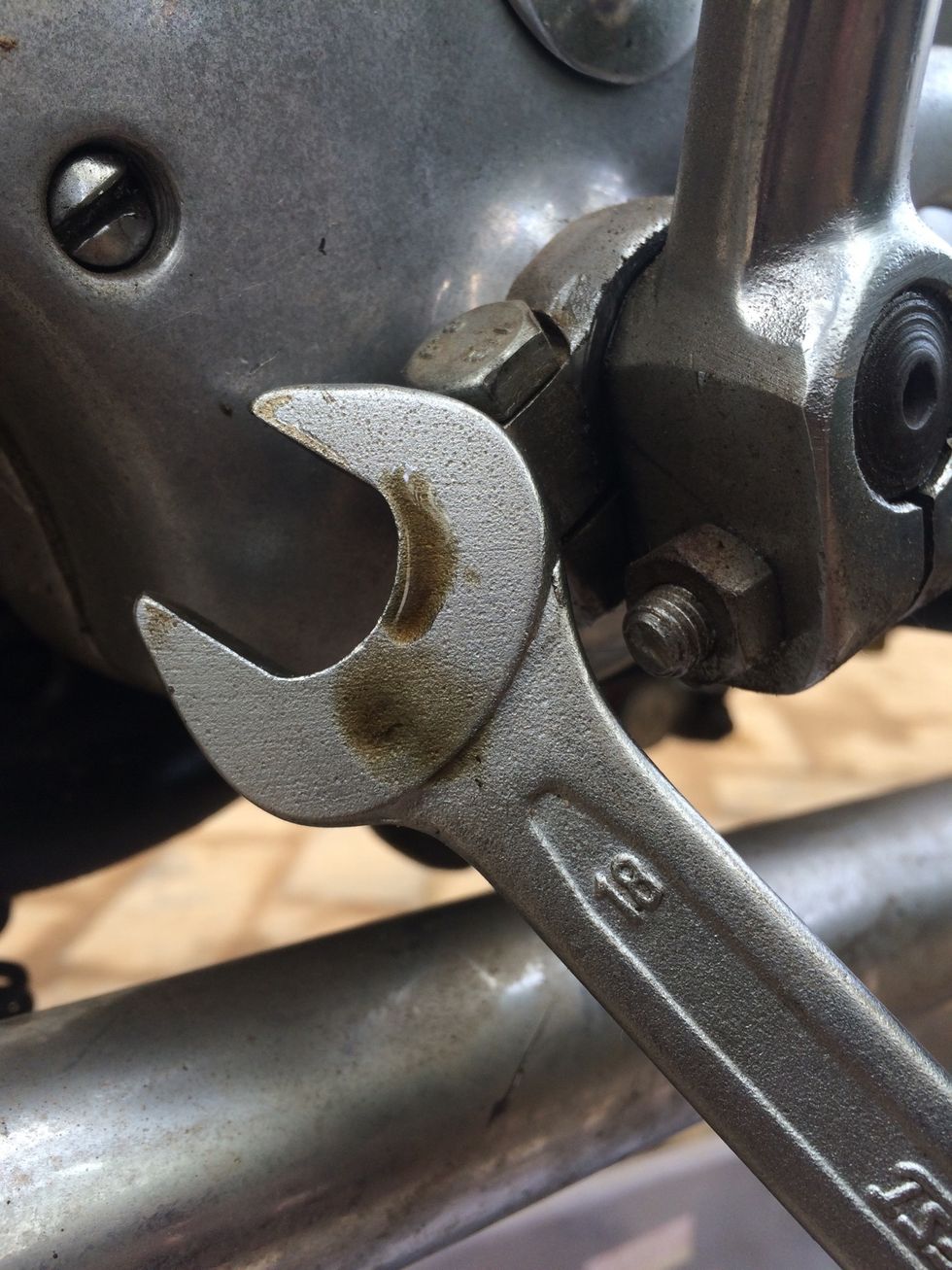 Again using a 18mm spanner remove the drain bolt at the bottom of the gear box. Note : if you are topping up fluid you can skip the removal of drain bolt and go to step no 16