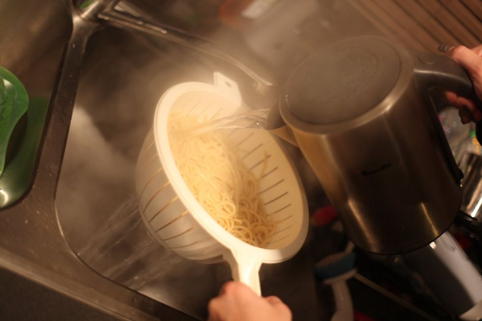 Again??? Yes boil your kettle and pour the water over the spaghetti. This method heats up the spaghetti again and helps cook the egg and cream.