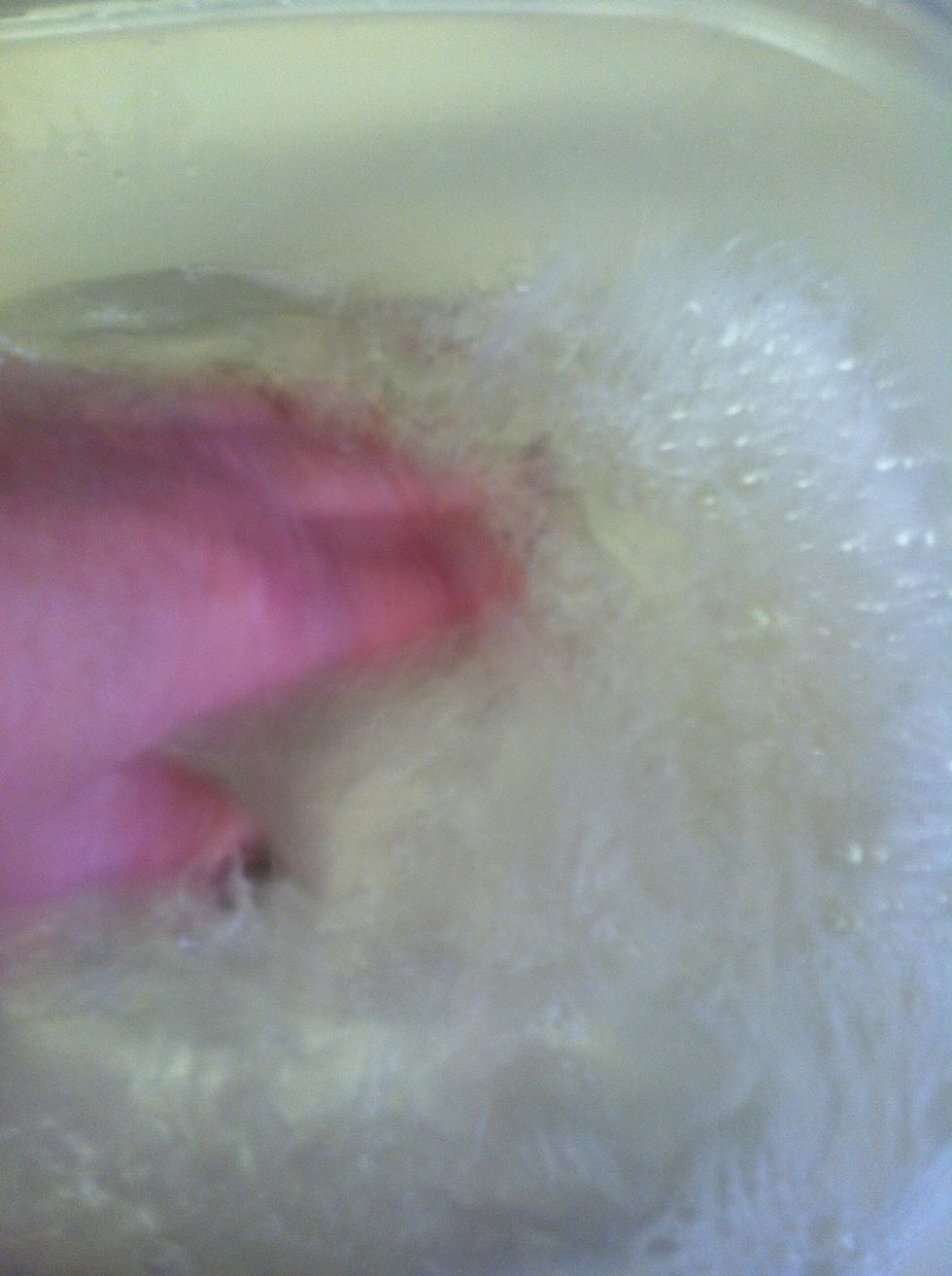 Agitate the water to make it sudsy.