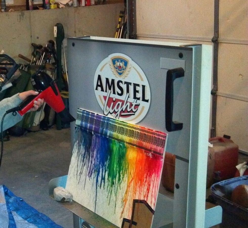 Aim the blowdryer at a downward angle and whatever color you want to drip put the dryer to the crayon. You can cover your picture using a piece of cardboard or you can just control the drip of crayons