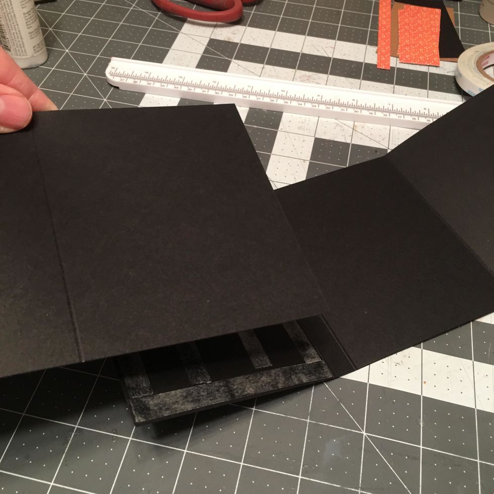 Align and attach down one section of the other long page fold out section. Be careful to line it up on all sides.