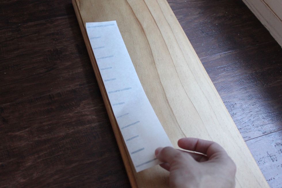 Align and press, using a credit card or something semi rigid. "Squeegee" over the transfer paper sever times to eliminate air bubbles and make sure the strips are adhered to the board.