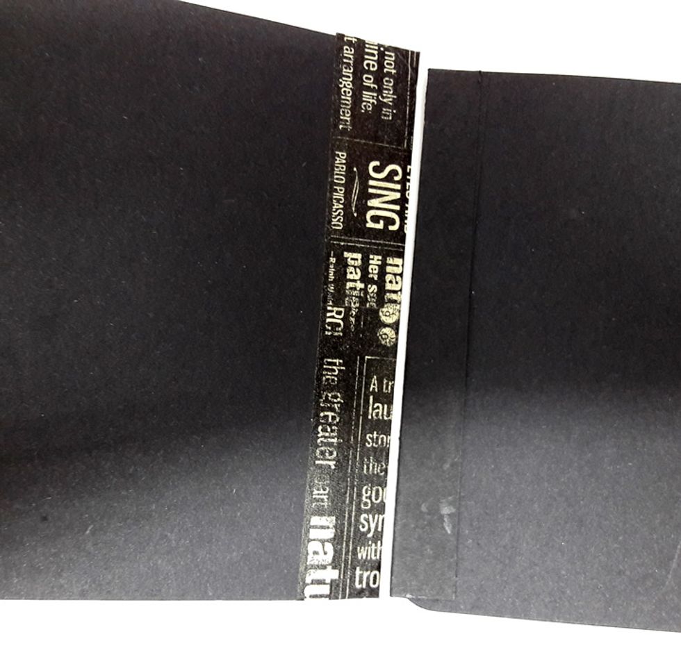 Align another page with strip facing the left. Attach page to bound pages with washi tape. Repeat process with other pages.