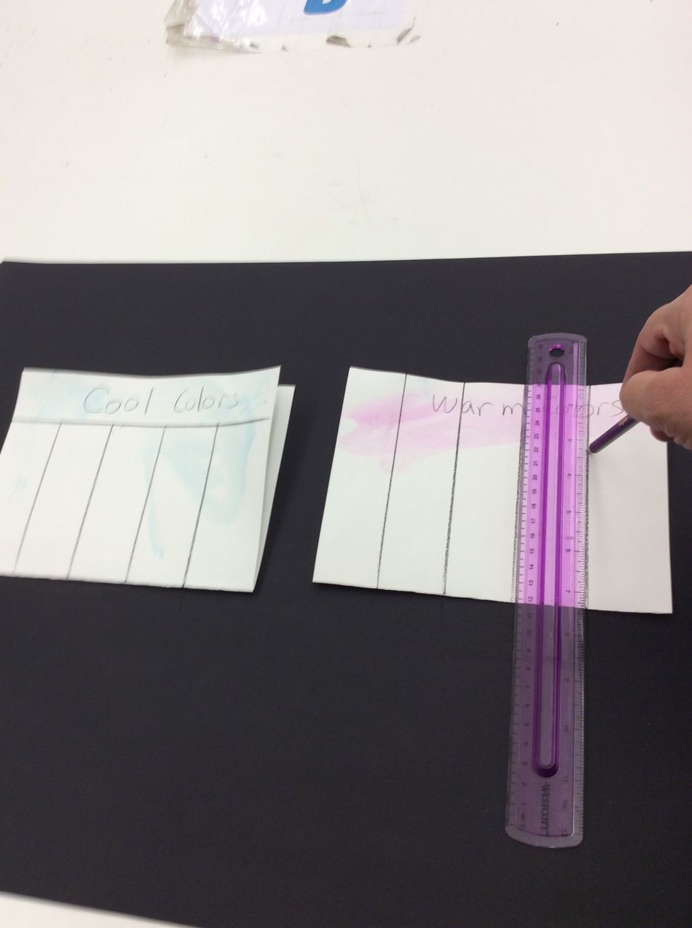 Align ruler vertically against side of paper. Draw vertical line from top of page to bottom of page. Repeat 3 more times.