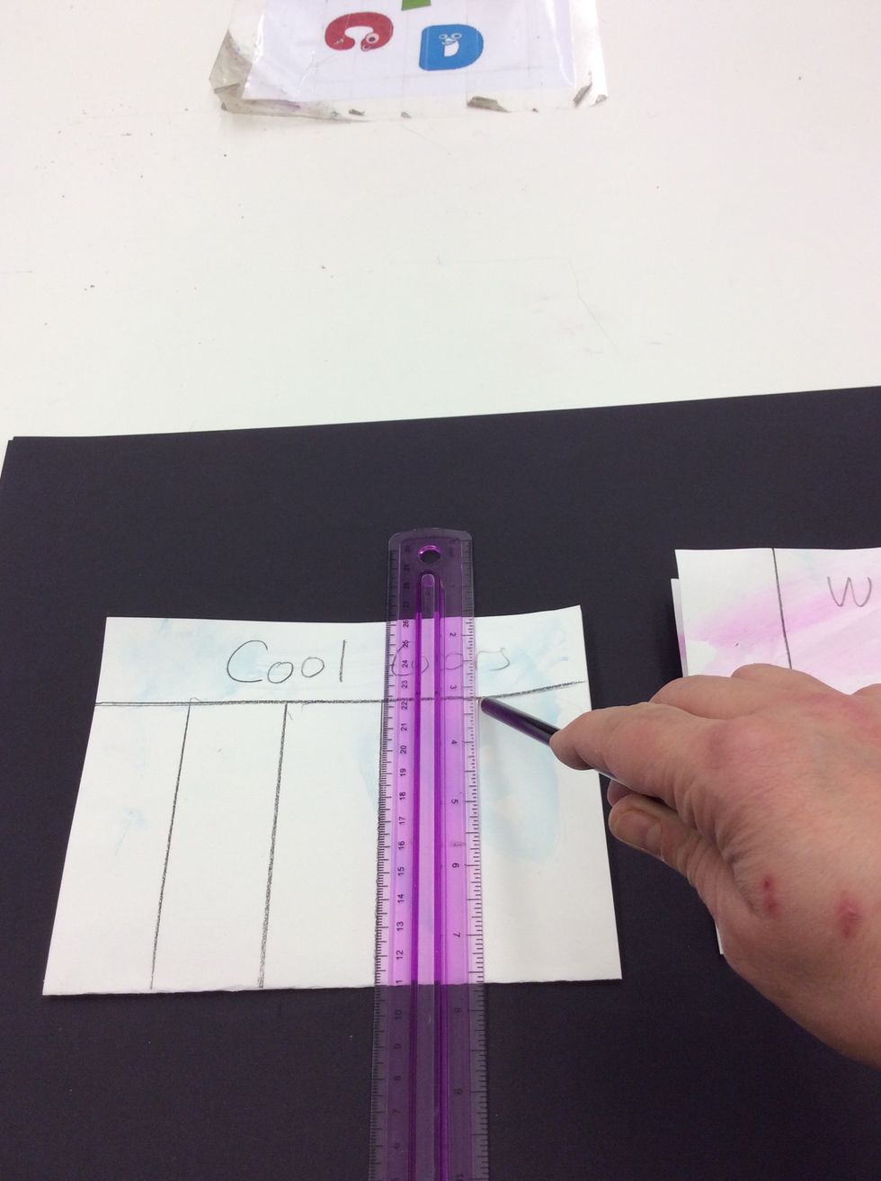 Align ruler vertically along side of paper. Draw vertical line against ruler edge from horizontal line to bottom of page (Do not draw line above horizontal line). Repeat across page 3 more times.